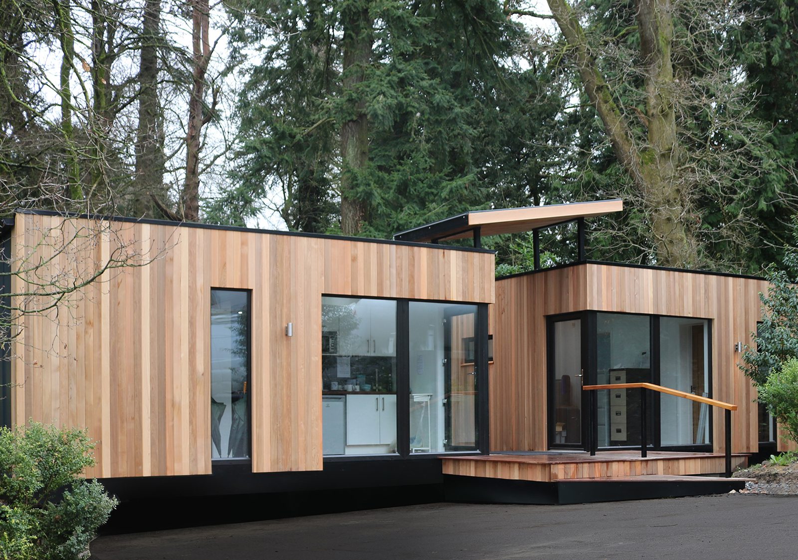 Cedar-clad lodges at Castle Leslie Estate