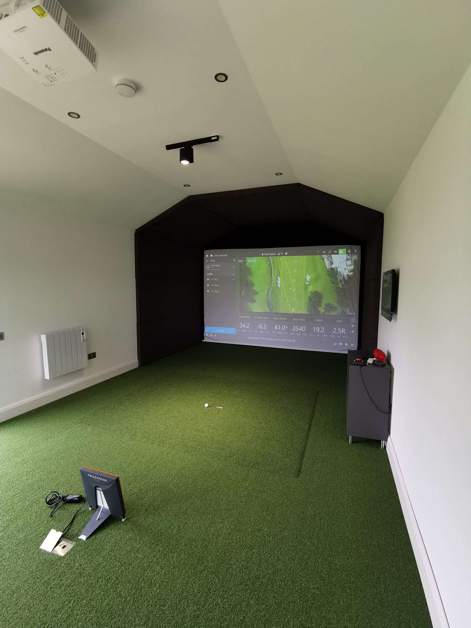 Golf simulation suite inside the studio
